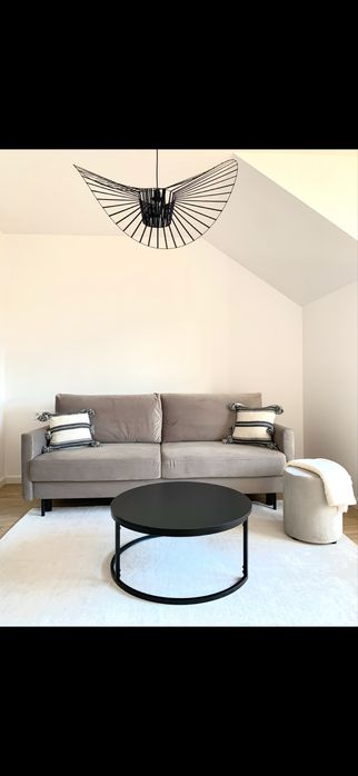 Sofa beżowa szara z funkcja spania nowoczesna rozkladana