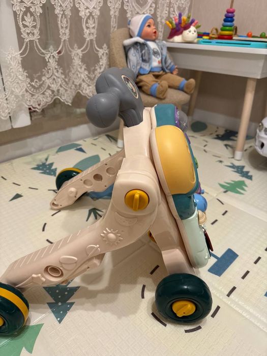 Дитячі розвиваючі ходунки-каталка