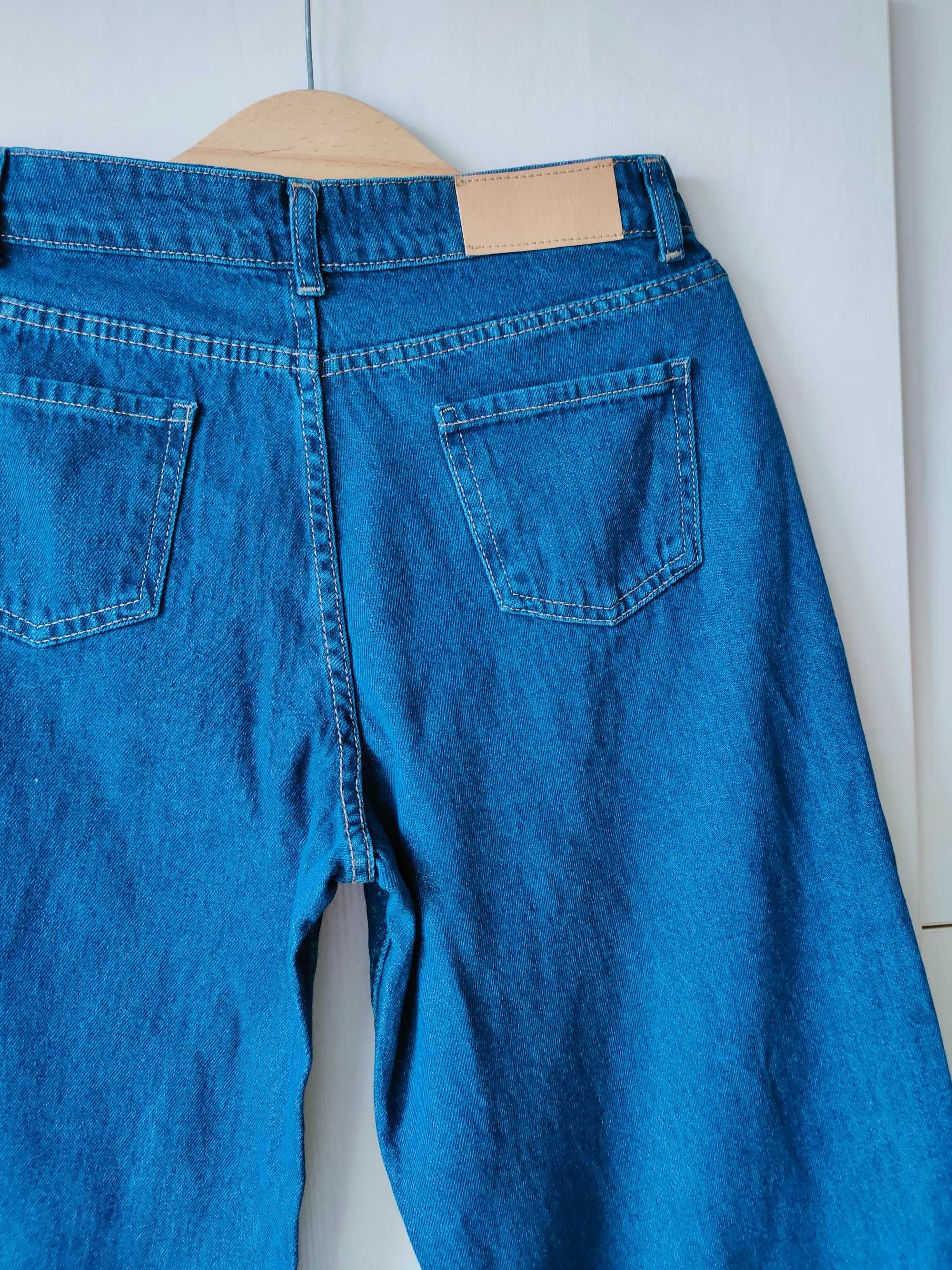 NOWE, niebieskie jeansy z przetarciami r. 40 (L)