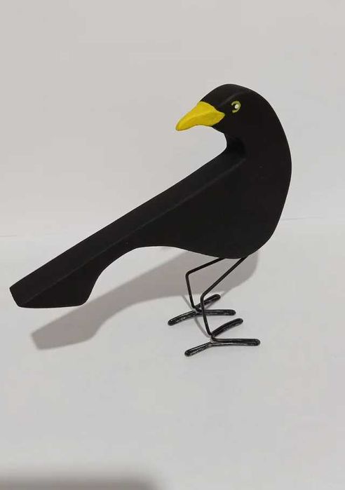 Conjunto de melros em madeira.