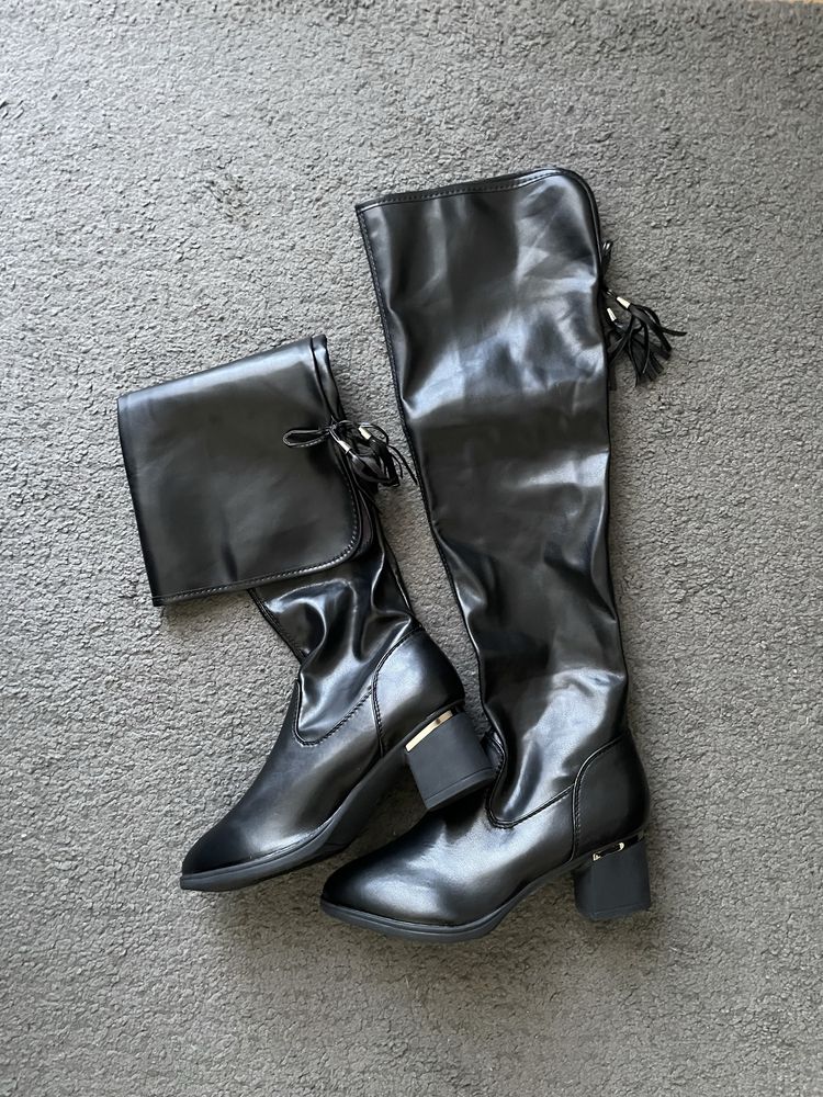 Botas acima do joelho