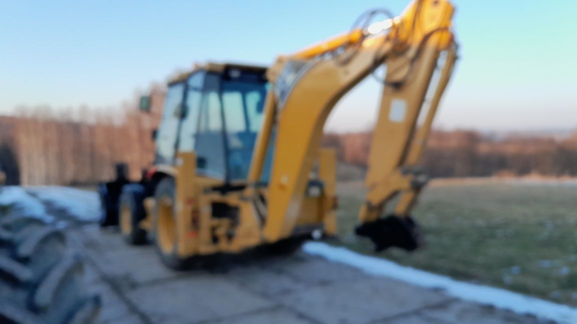 Koparko-ładowarka CAT 428D JCB CASE VOLVO