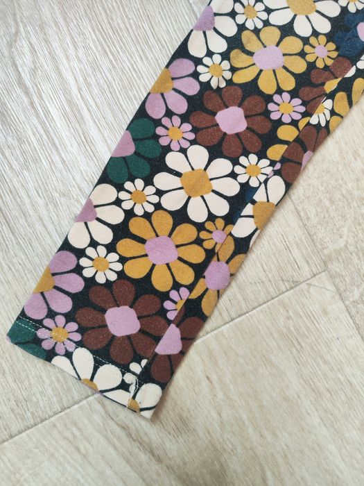 Next legginsy jesienne 128 kwiaty rude zielone długie elastyczne