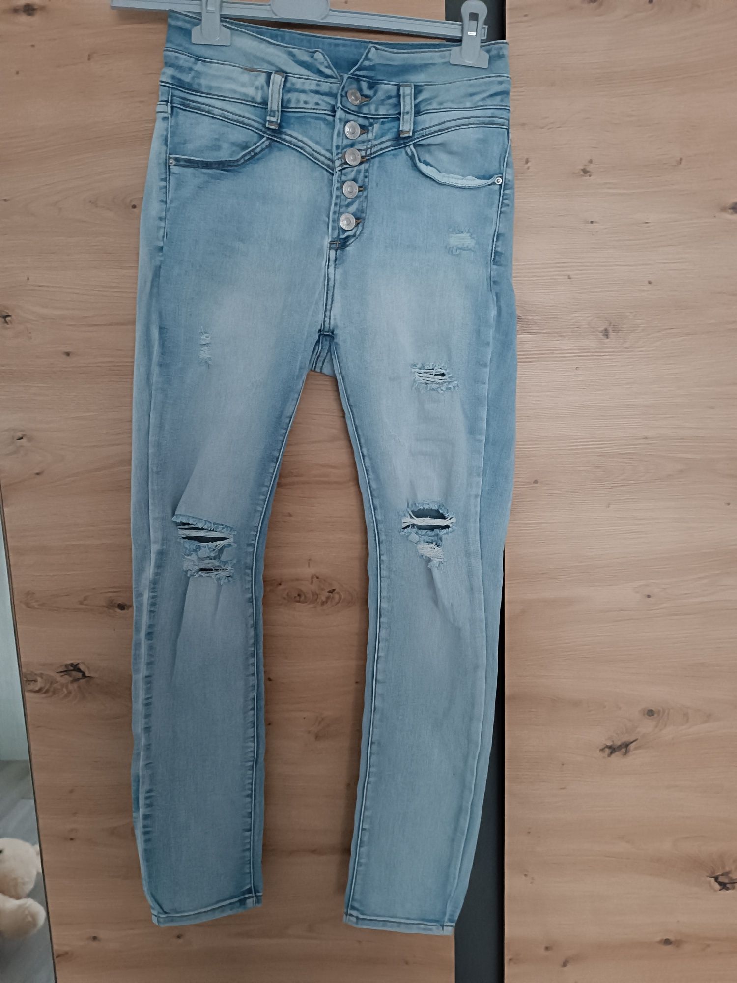 Spodnie jeansowe rurki damskie przetarcia L