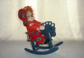 Немецкая фарфоровая коллекционная кукла Клоун на лошадке-качалке 20 см
