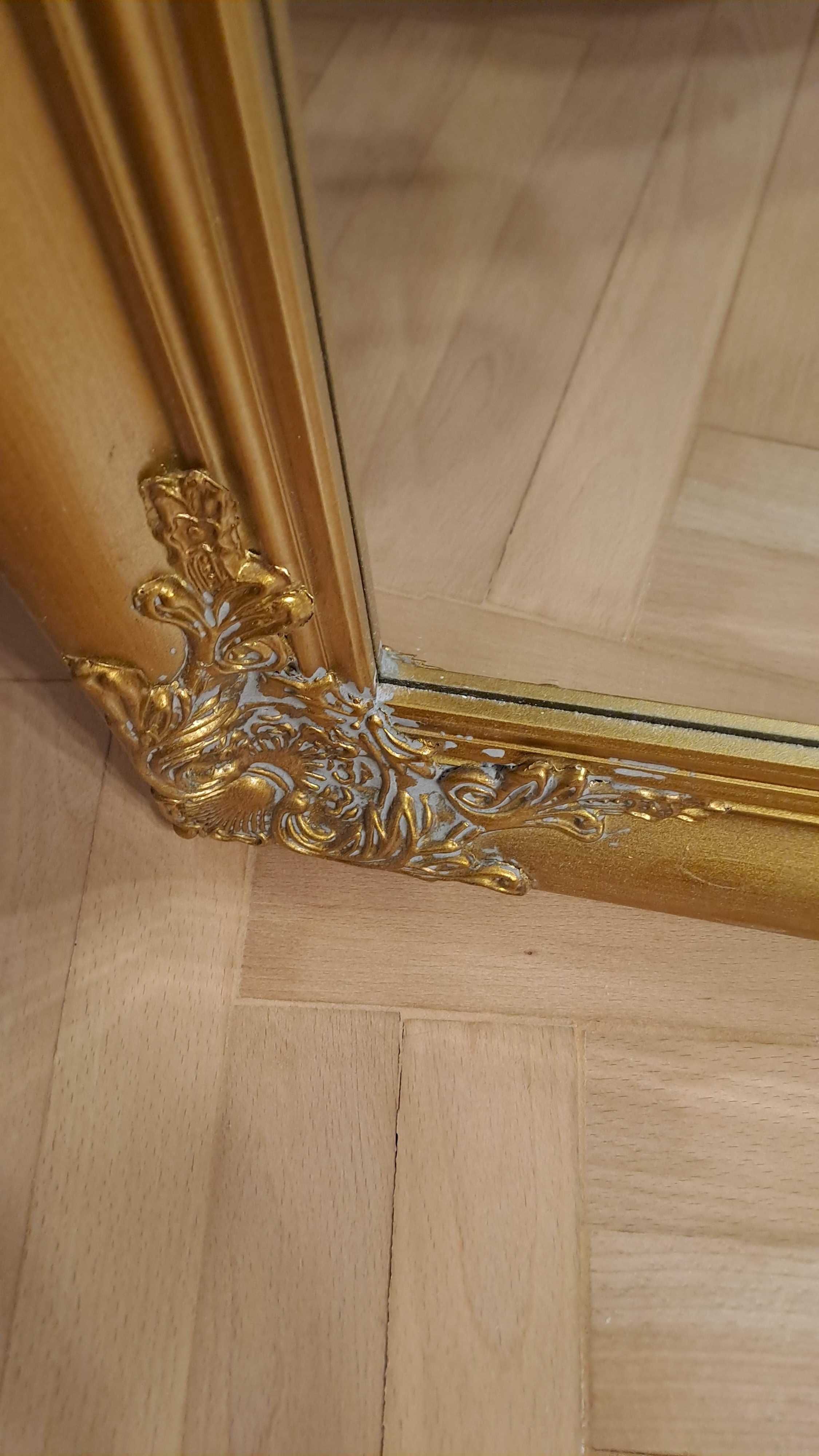 Nowe lustro w z łotej ozdobnej ramie