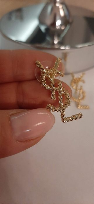 Duże, pozłacane kolczyki ysl model Opyum Cudo lv cc