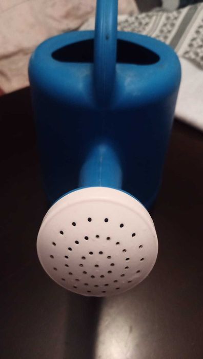 Regador de plástico