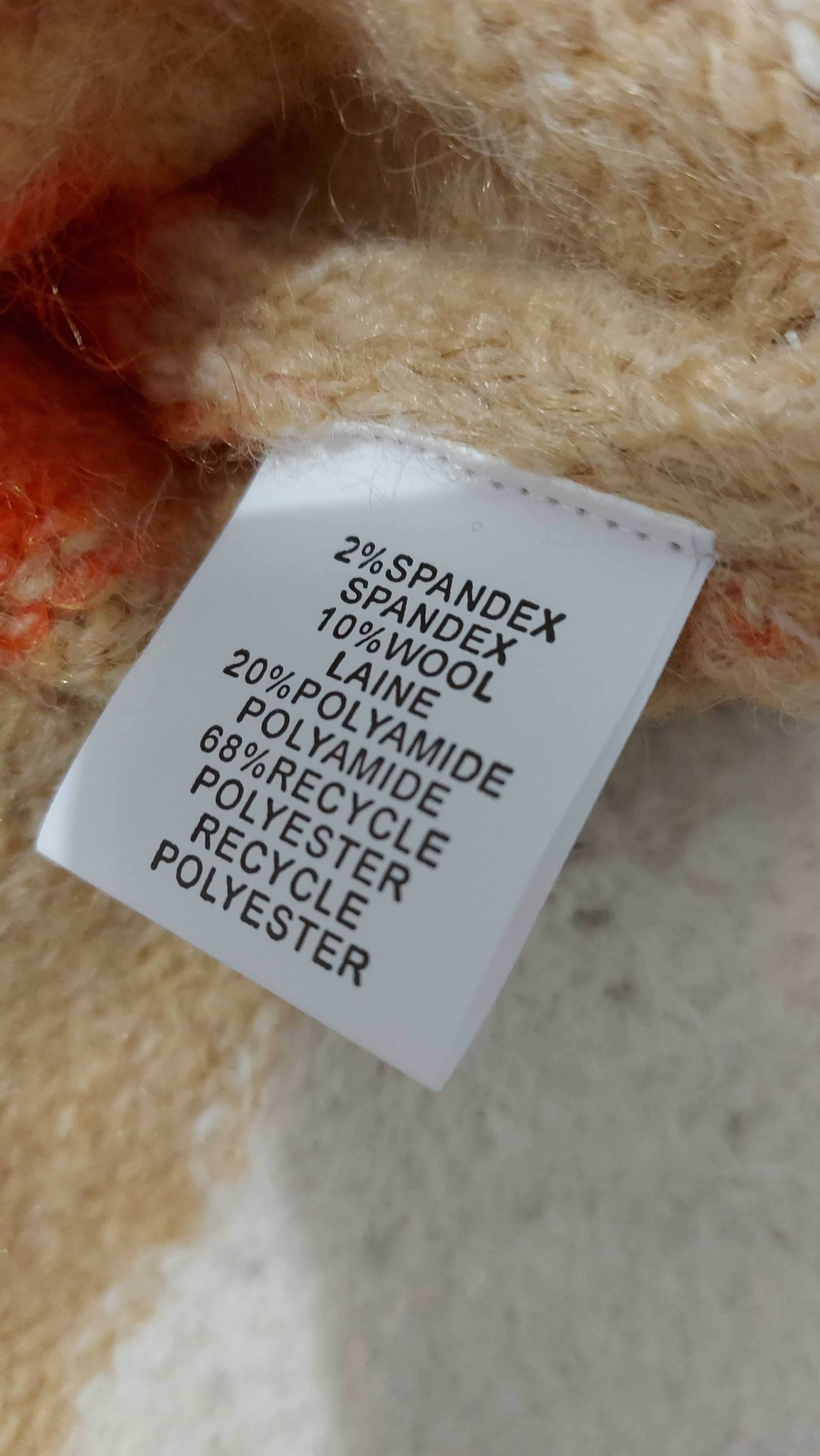 Sweter ażurowy w pasy .