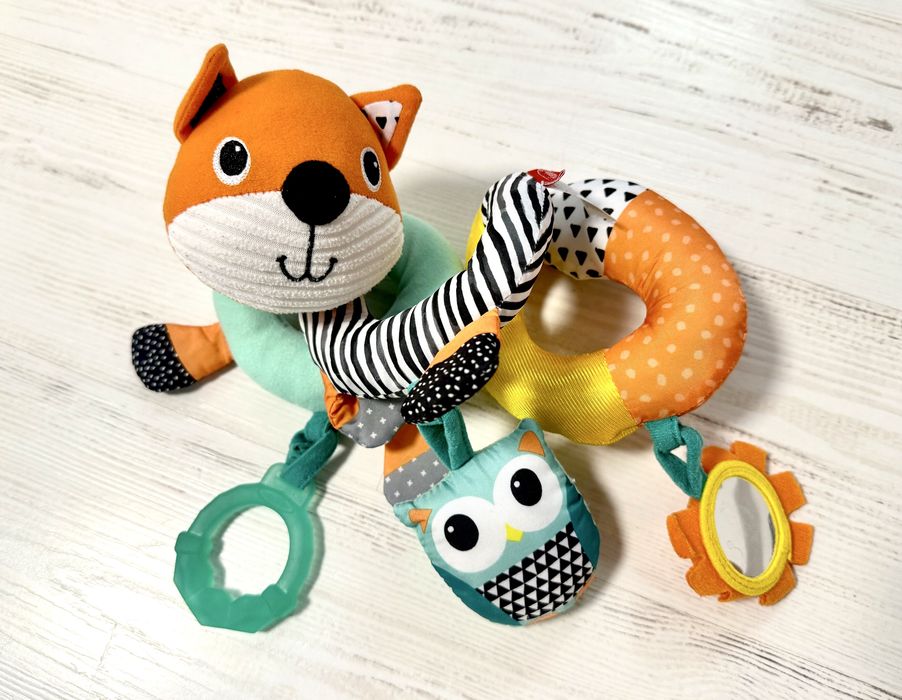Іграшки для немовлят: спіральки, жираф, слоник, змійки.