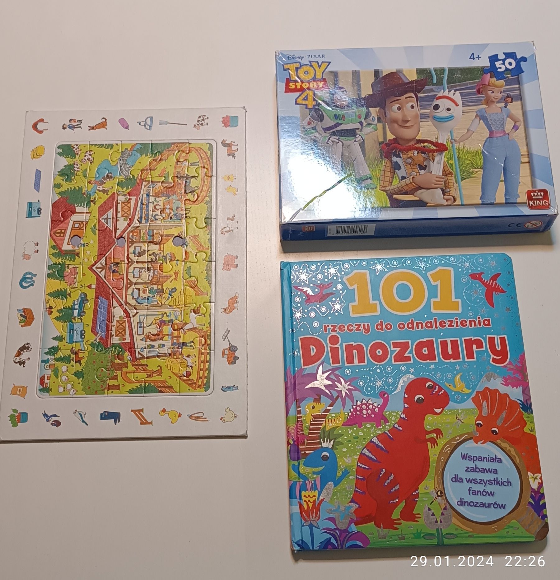 Zestaw puzzle + książka o dinozaurach z zagadkami