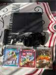Playstation 3 super slim 3 gry 2 pady