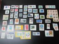 Filatelia: Lote 6 - Canadá, cerca 70 selos usados colados em papel