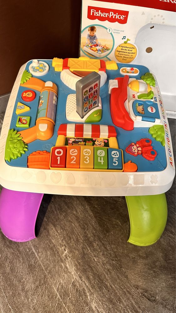 Stolik edukacyjny Fisher Price w języku niemieckim i angielskim