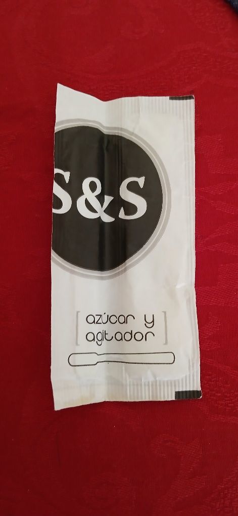 Pacote de açúcar e colher, espanhol