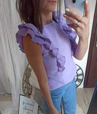 Liliowa bluzka z falbankami