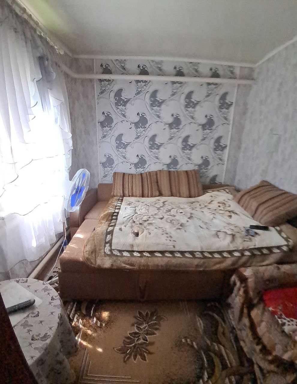 Продам 1\2 частину  будинку в центрі міста Чугуїв!