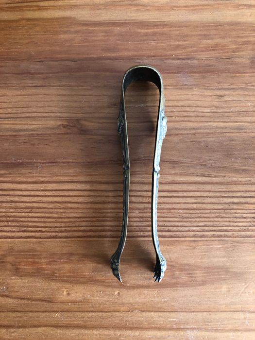 Pinça de açúcar em garra