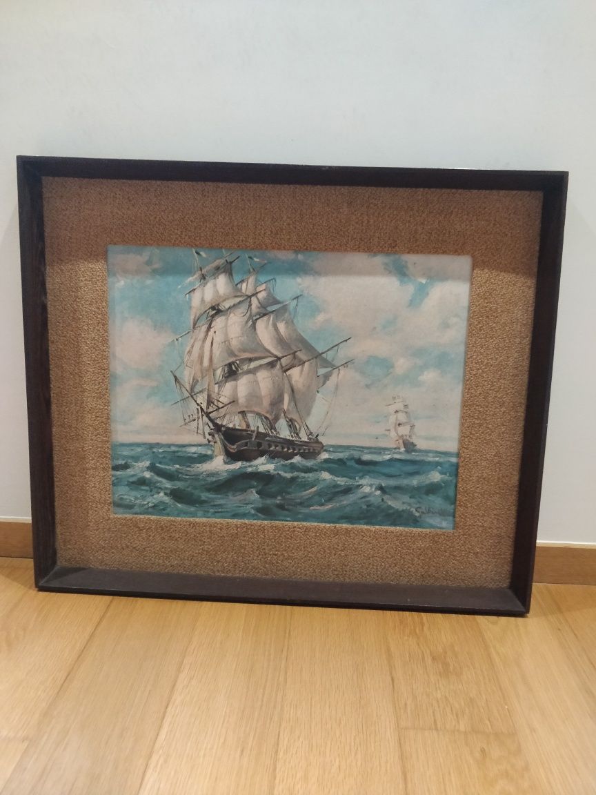 Quadro com pintura de dois veleiros.