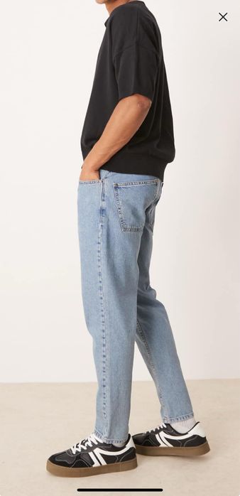 ASOS DESIGN tapered fit jeans in light wash blue