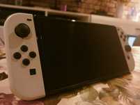 Nintendo Switch OLED + Gry I Case