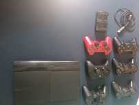 PS3 super slim + gry + pady