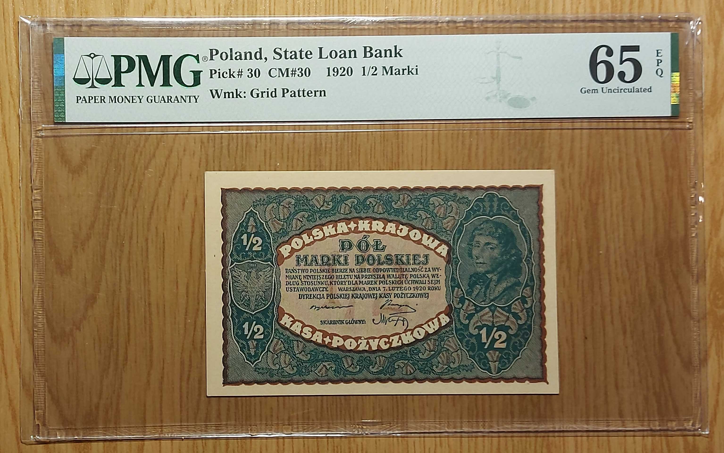 Banknot 1/2 marki polskiej z 1919 roku. PMG 65.