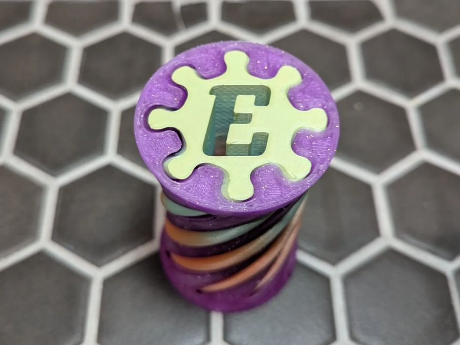 Brinquedo Fidget Espiral Letra E Giratório 180 Graus