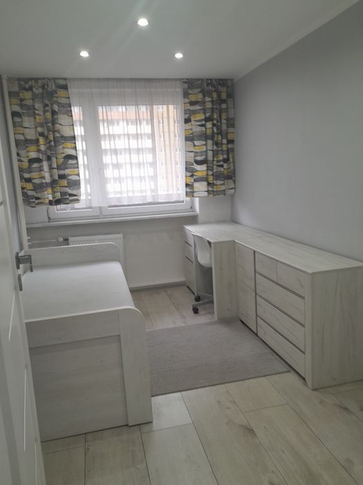 Mieszkanie dwupokojowe z dodatkowym pomieszczeniem oraz balkonem