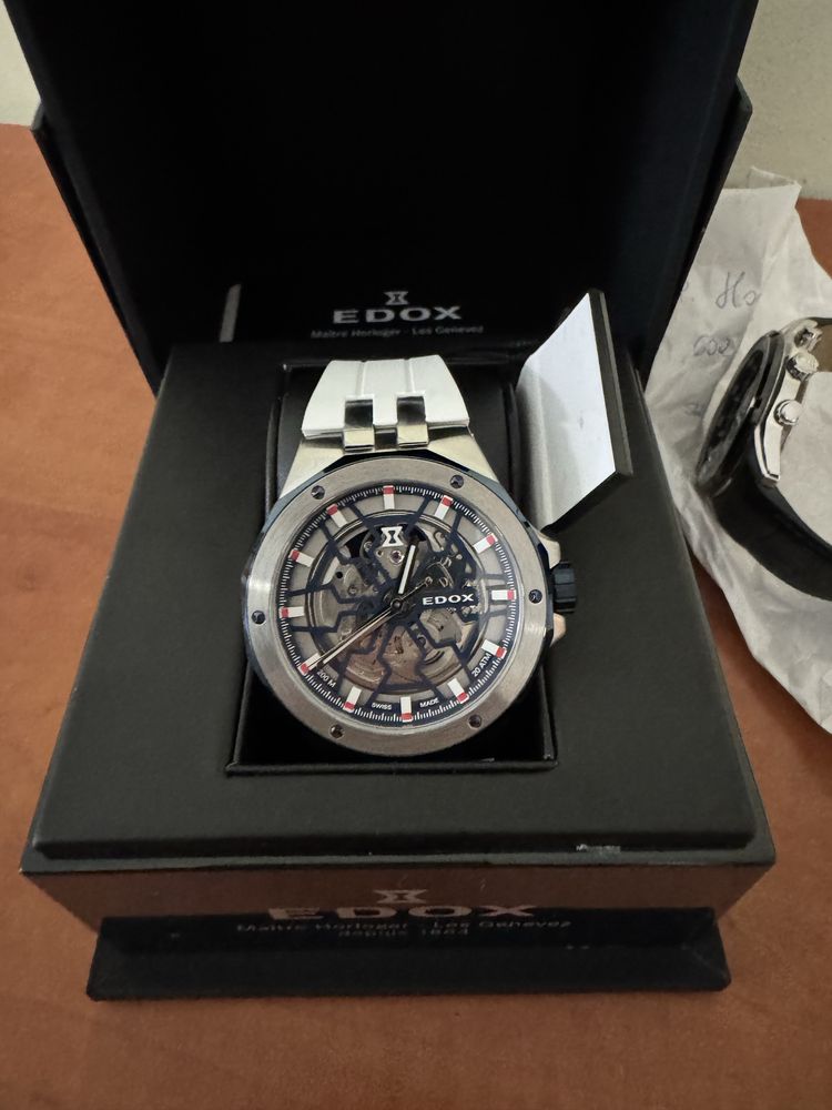 Edox Delfin Mecano nowy, automat, szafir, skeleton