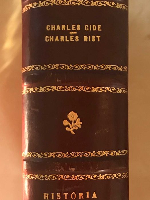 Livro antigo encadernado - História das Economias de Charles Gide