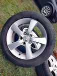 Oryginalne felgi aluminiowe mazda 16" z 2 letnimi oponami DUNLOP