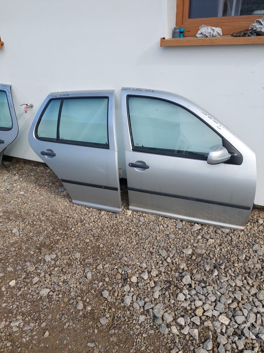 Drzwi lewe golf IV 4 2002r srebrne LA7W
