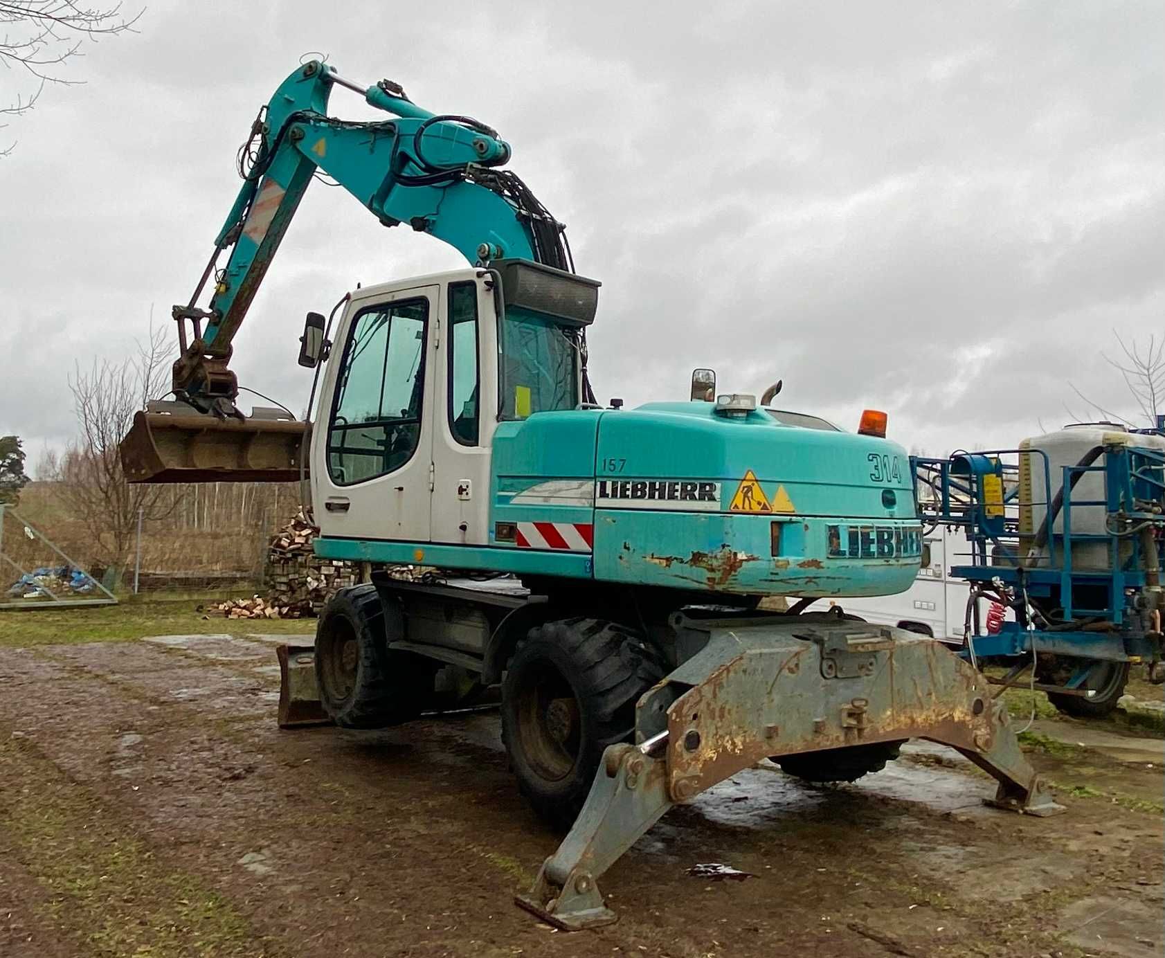 Koparka kołowa Liebherr A 314 LITRONIC 4x4 + łyżki