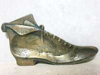 Antiga bilheteira 'velho sapato" em bronze