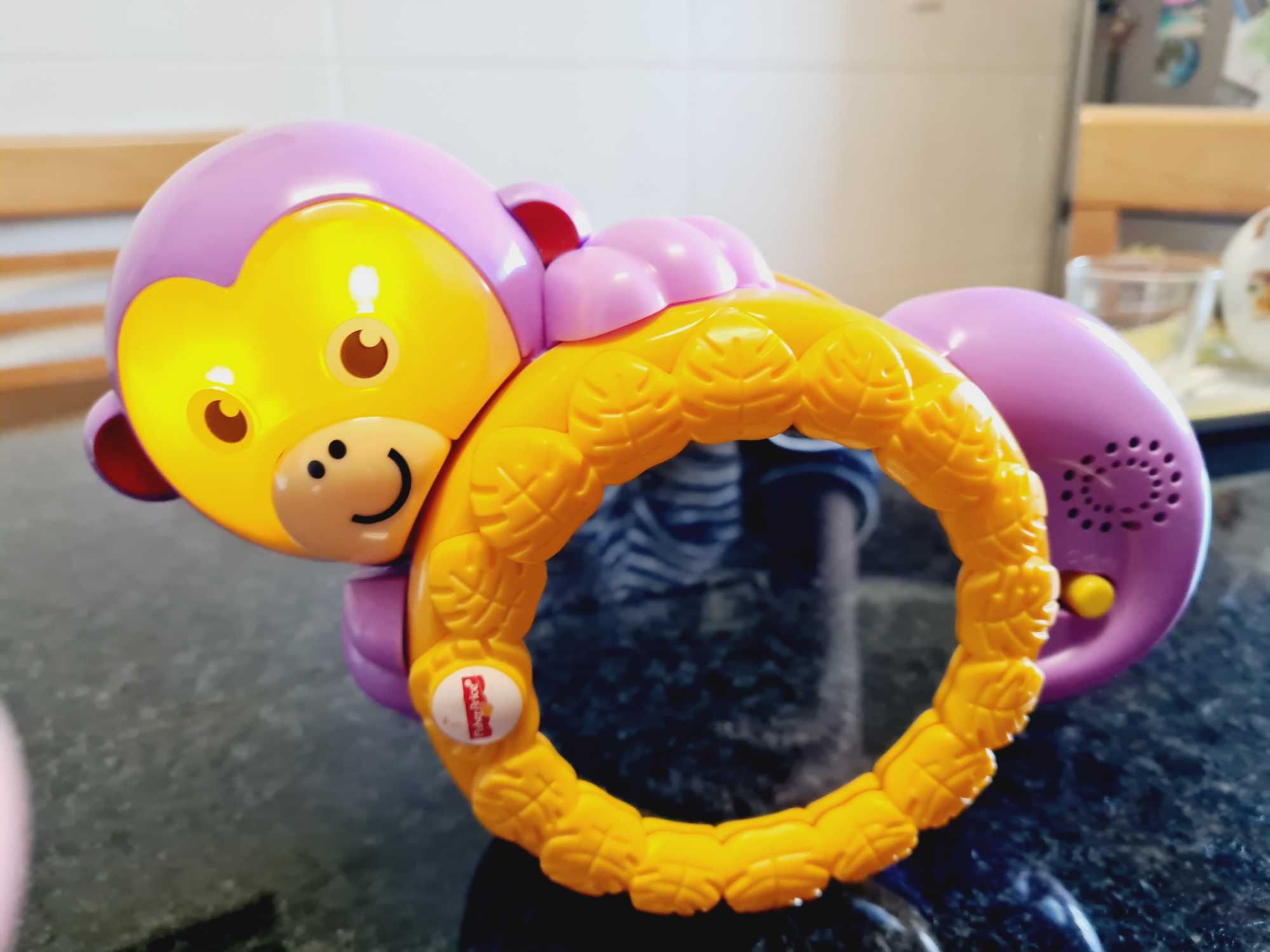 Brinquedo crawl along monkey