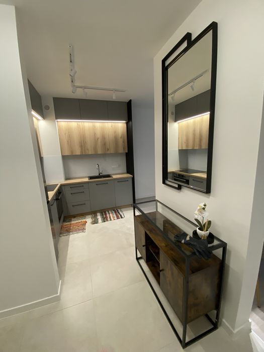 Wynajmę mieszkanie z miejscem parkingowym .