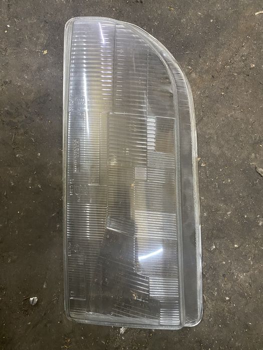 Стекло фары левой форд сиера  новое
