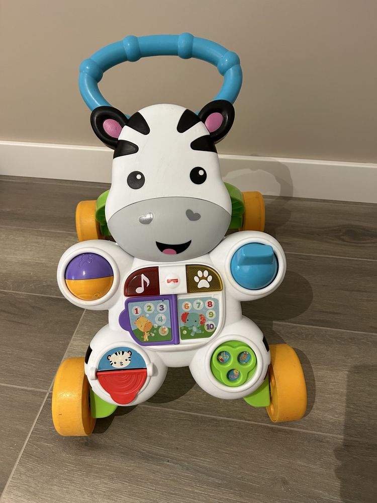 Pchacz jeździk Fisher Price