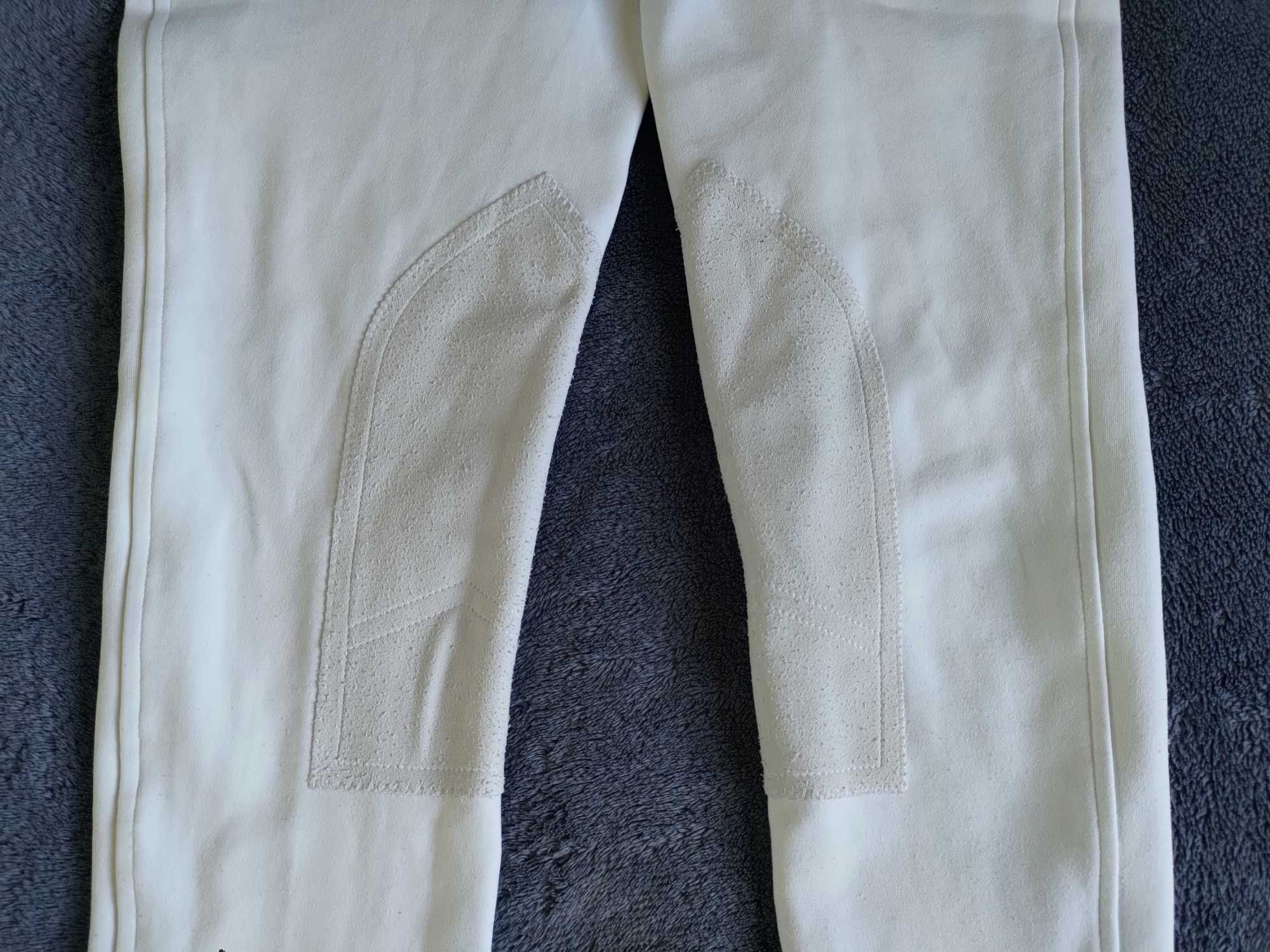 Białe bryczesy jeździeckie z materiałowym lejem na 164 cm