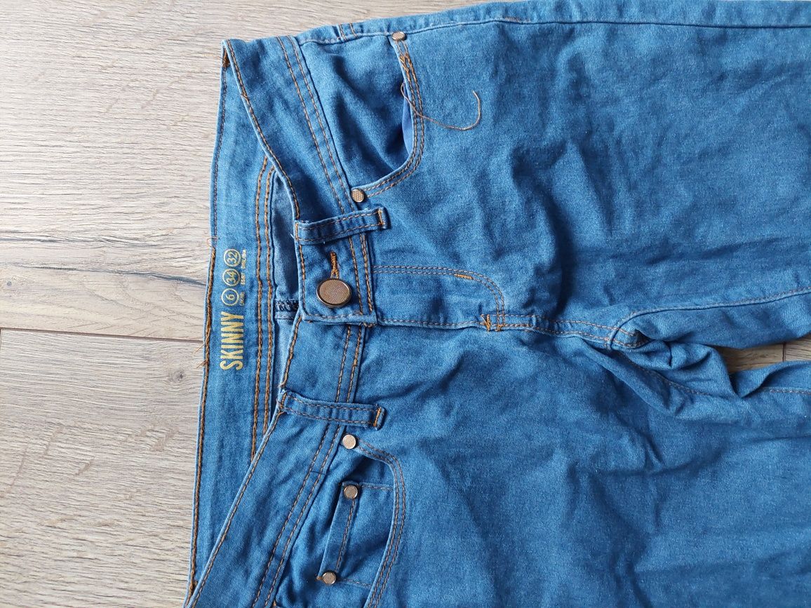 Jasnoniebieskie spodnie dżinsy skinny 34