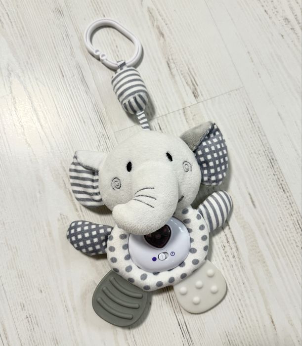 Іграшки для немовлят: спіральки, жираф, слоник, змійки.