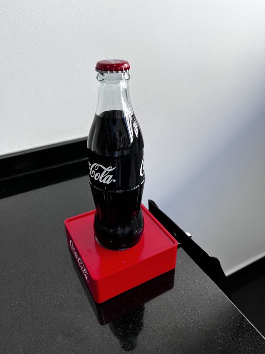 Coca Cola descapsulador saca caricas
