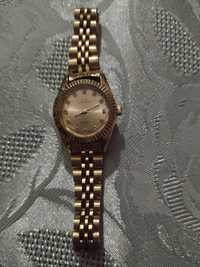Zegarek damski  w kol złotym