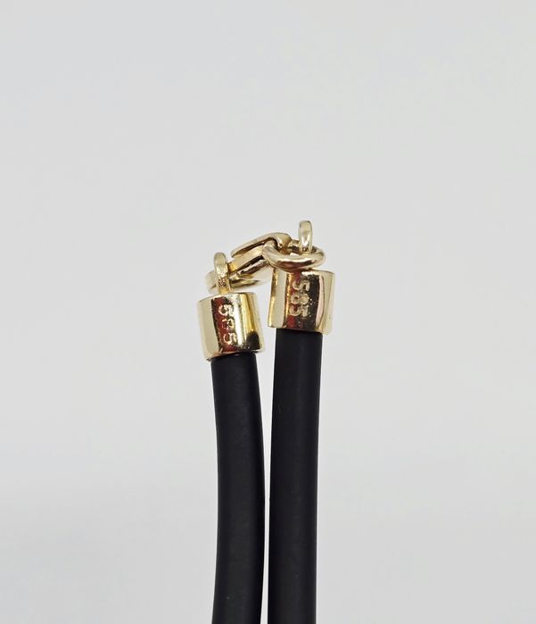 Naszyjnik na kauczuku ze złotymi elementami próba 585 14k 
- Waga: g