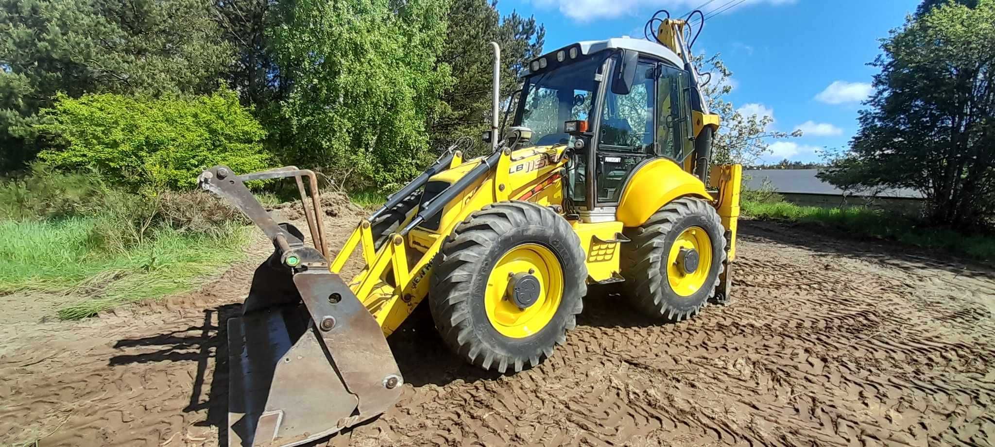 Koparko Ładowarka New Holland LB115 b 2008r Nowe opony 3 łyżki widły