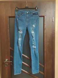 Spodnie elastyczne jeansy dżinsy bawełniane z rozdarciami r 40 L H&M