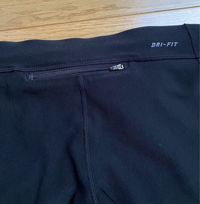 Damskie legginsy getry spodenki 3/4 sportowe do biegania Nike roz. S