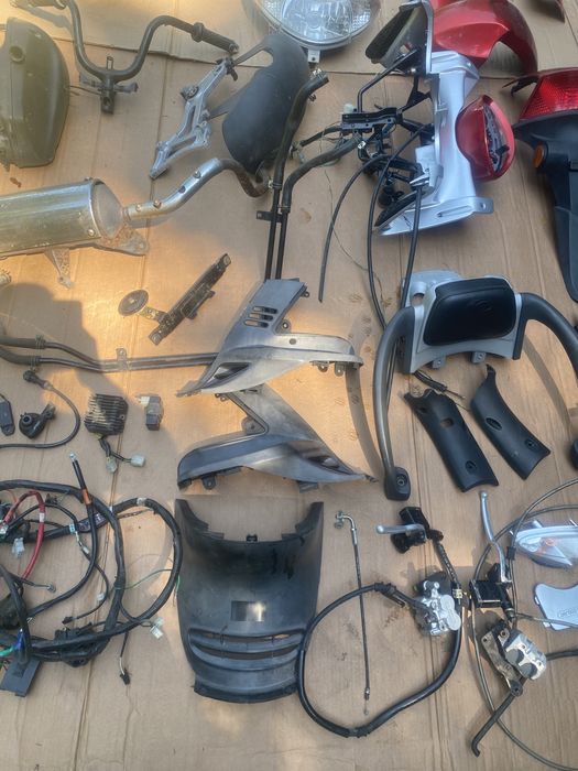 Kymco Grandink 125 owiewka licznik lampa koło zacisk amortyzator bak