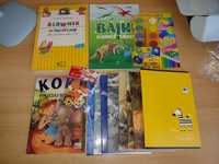 Książka o dinozaurach i o słoniątku, zeszyty, kredki, farby i słownik